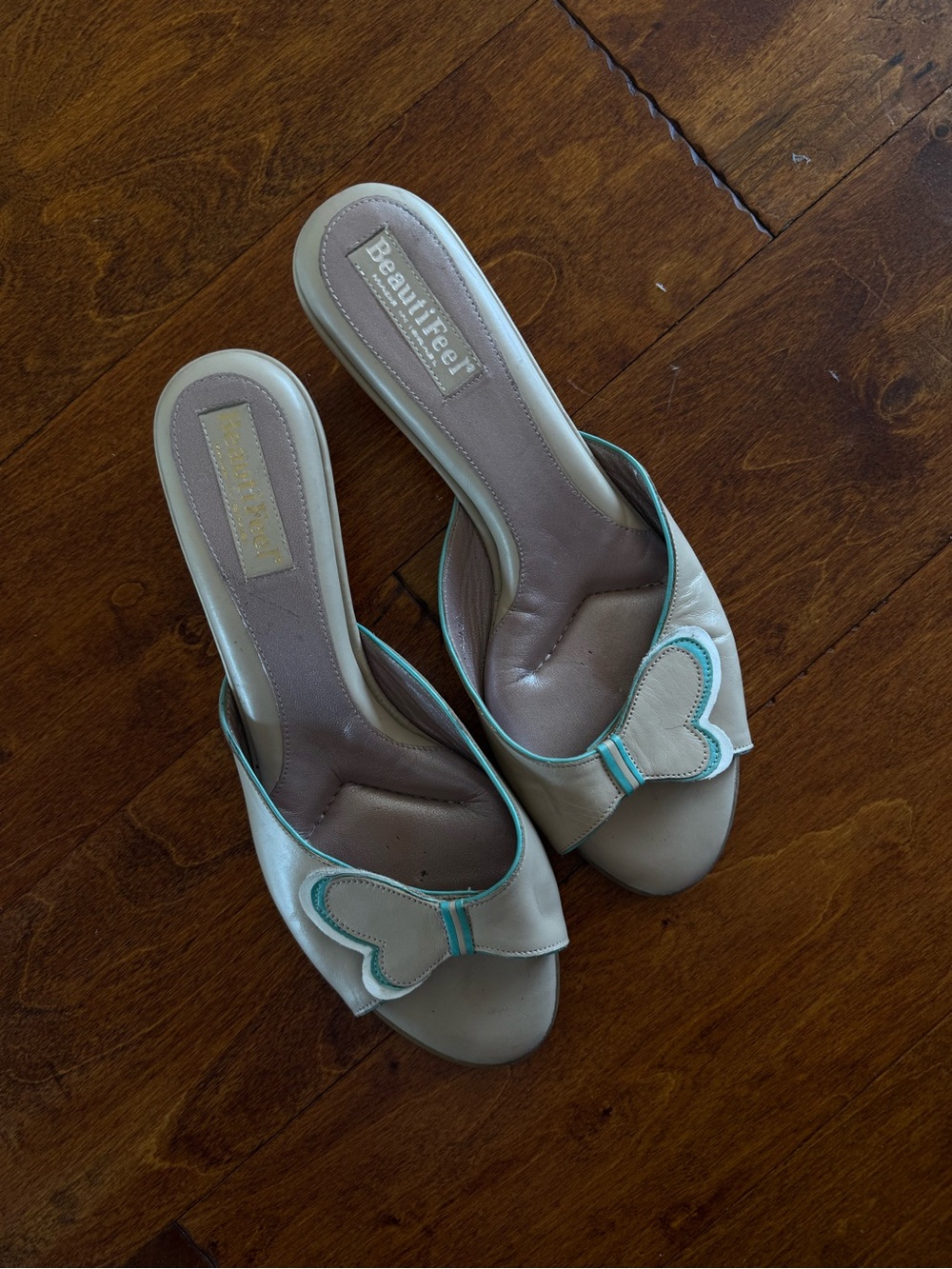 BeautiFeel Cream Slide Mules with Teal Trim and Butterfly Accent